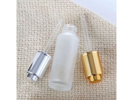 Flacon compte-goutte transparent à bouton poussoir