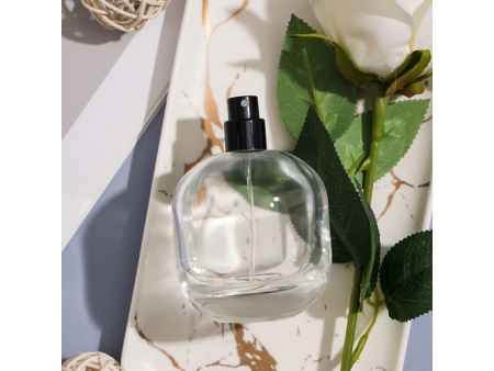 Flacon de parfum ovale dépoli et transparent
