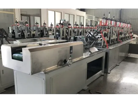 Machine de production de cornières de protection en carton