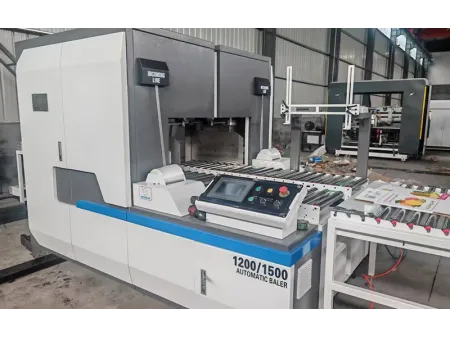 Machine de cerclage pour carton ondulé