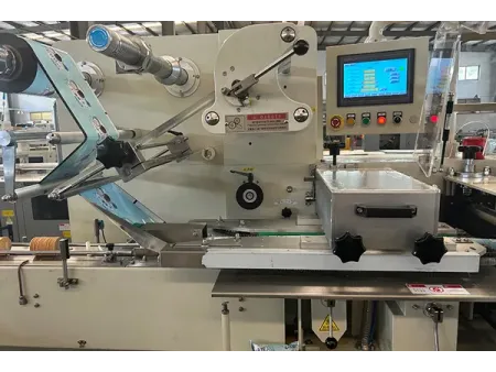 Machine de conditionnement horizontal sans barquette SF-G (conditionnement de biscuits sur chant à double goulotte)