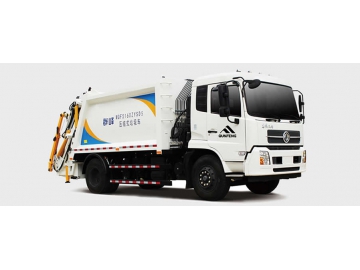 Camion compacteur de déchets à chargement arrière