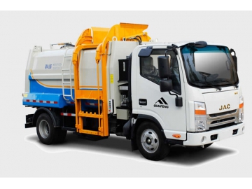 Camion compacteur de déchets à chargement latérale