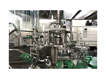 Remplisseuse, capsuleuse, laveuse pour bouteille en verre