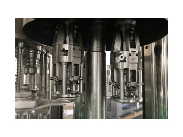 Remplisseuse, capsuleuse, laveuse pour bouteille en verre