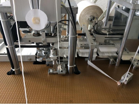 Machine de soudure ultrasons pour boucle interne de masque jetable