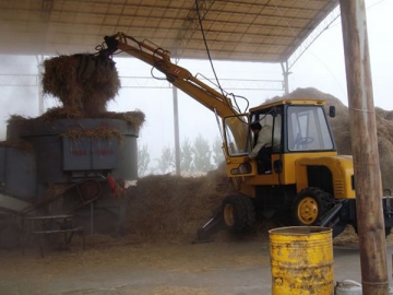 Chargeuse sur pneus à godet grappin